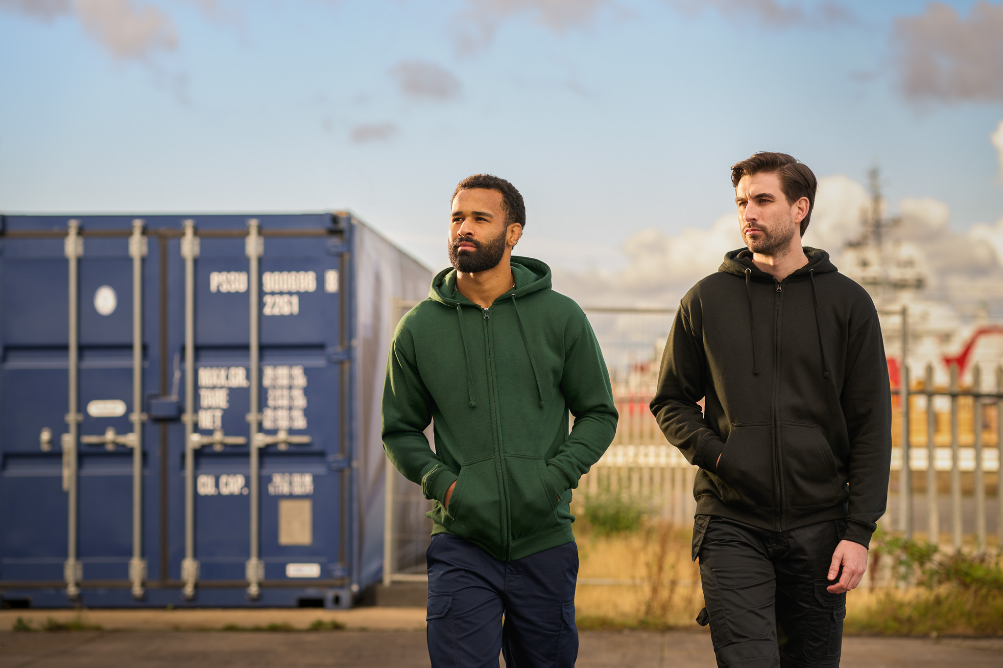 PRO RTX hoodies in green and black worn outdoors