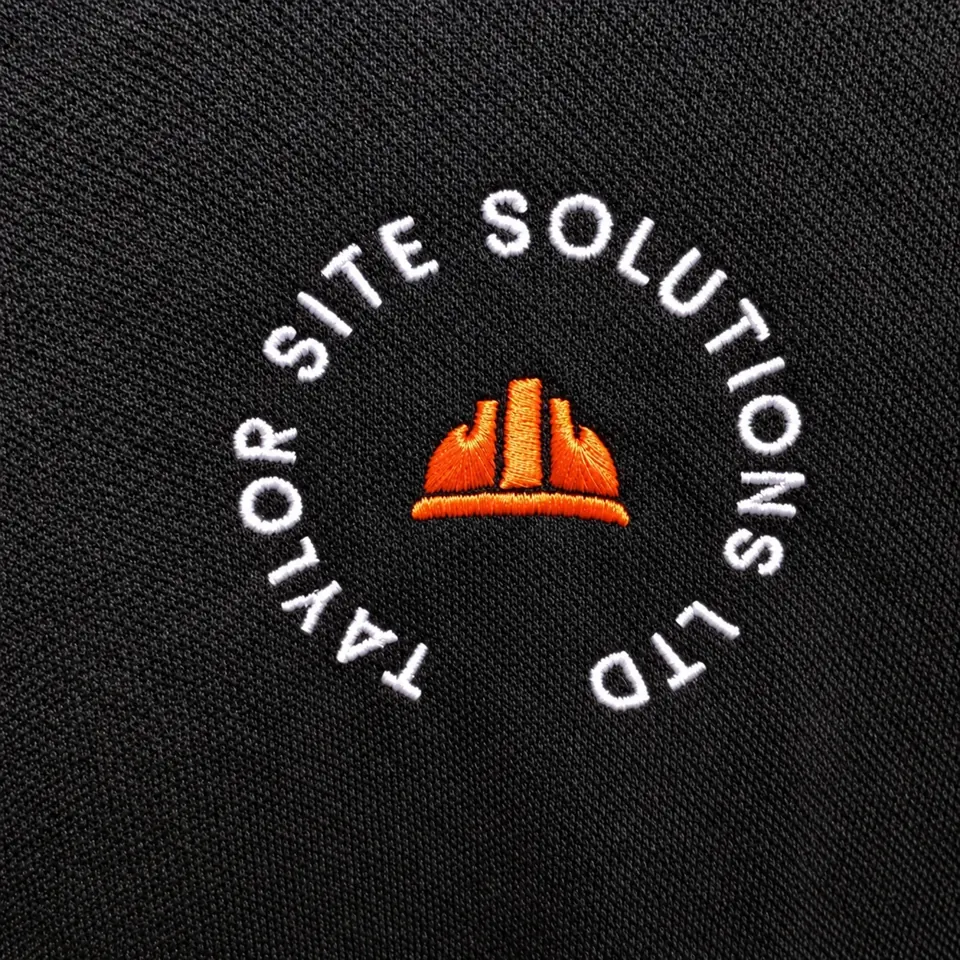 Taylor Site Solutions Ltd logo stitched in white and orange on black fabric